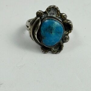 Navajo sterling silver ring with a central turquoise stone